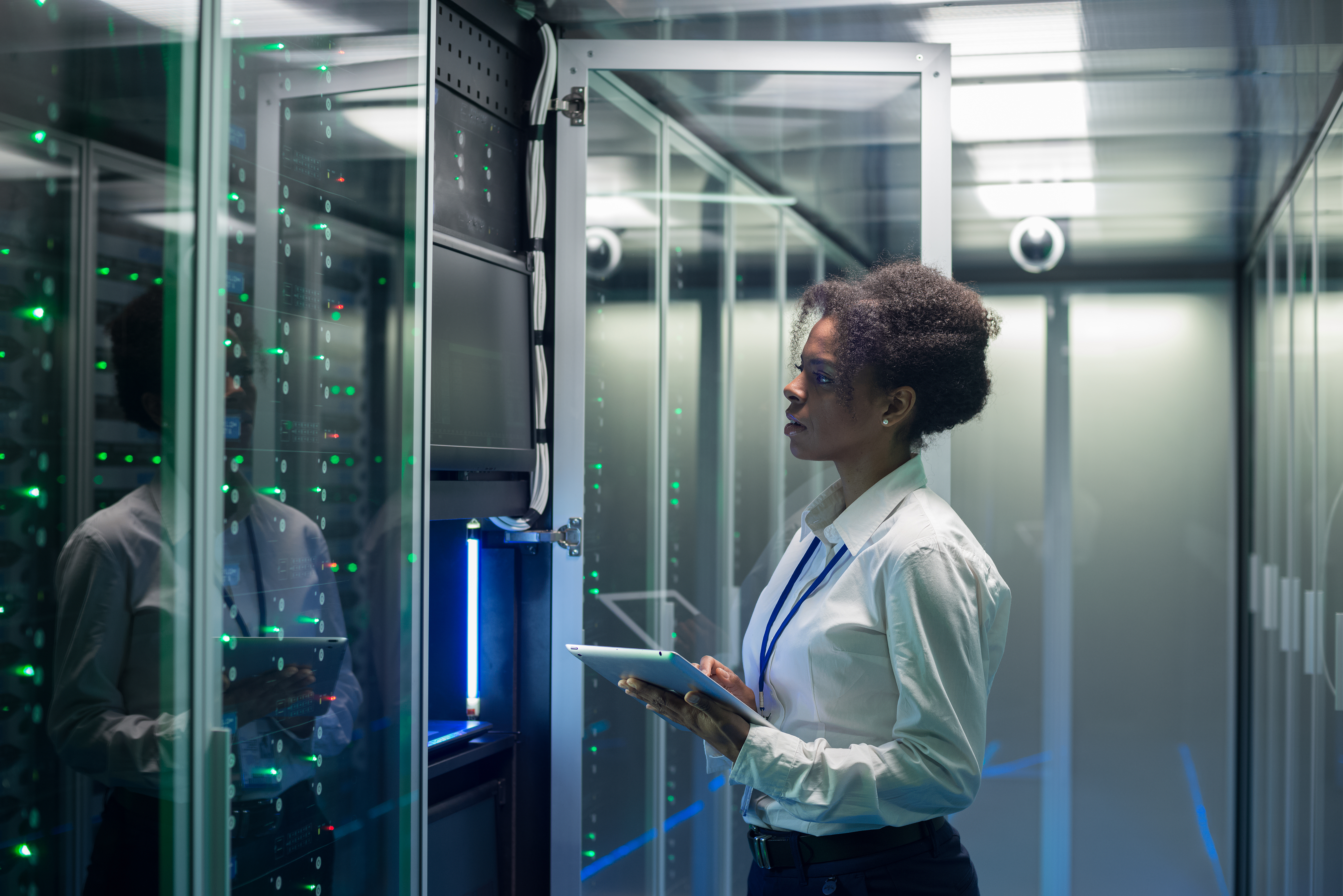 Young Woman In Data Center Shutterstock 1293015184 Young woman in data center server room