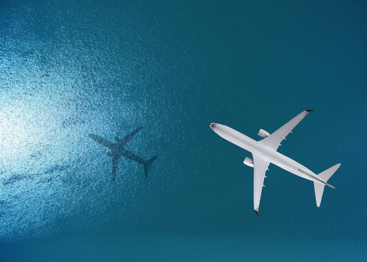 Airplane Flies Over The Sea