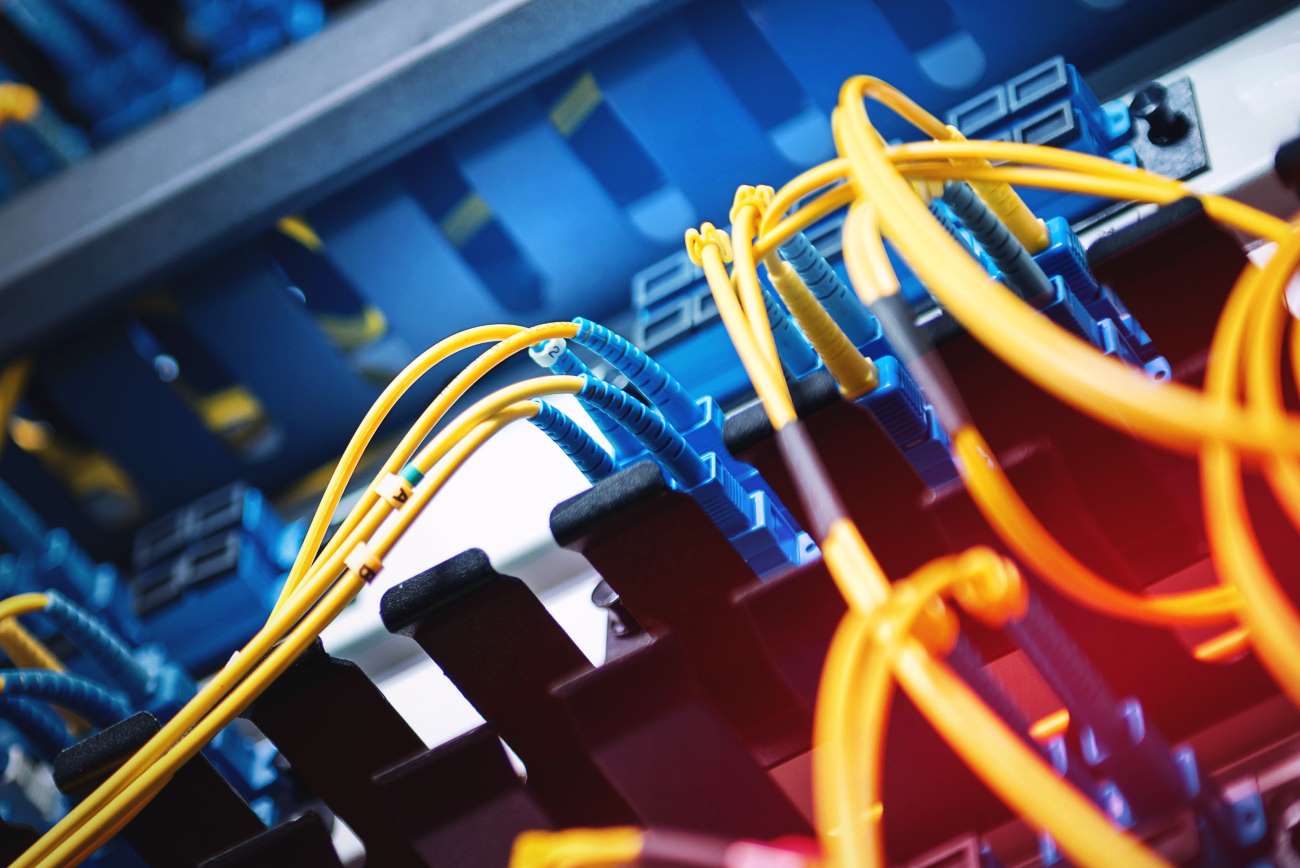 Fiber_Optic_Cables_in_Server_Room_Closeup Fiber_Optic_Cables_in_Server_Room_Closeup