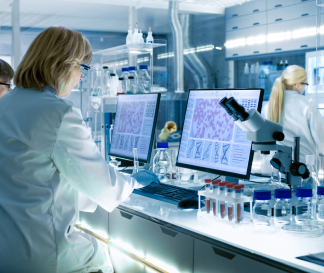 Female and Male Scientists Working in Laboratory