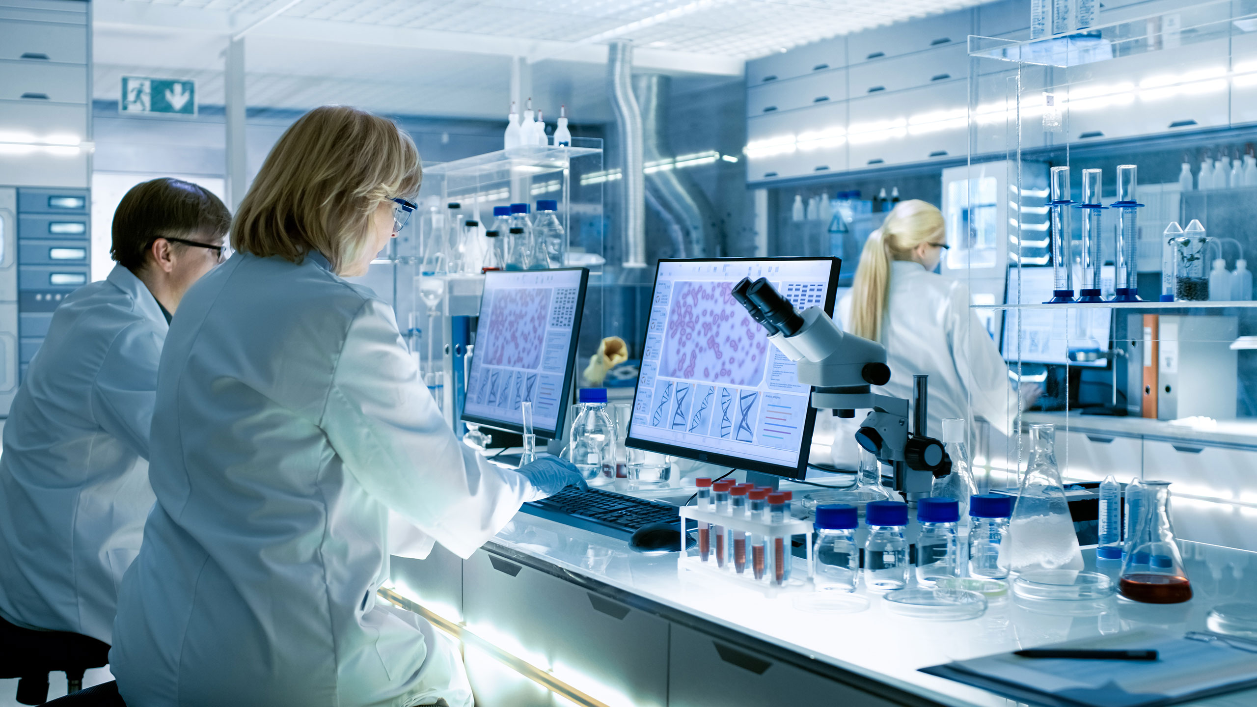 Female and Male Scientists Working in Laboratory