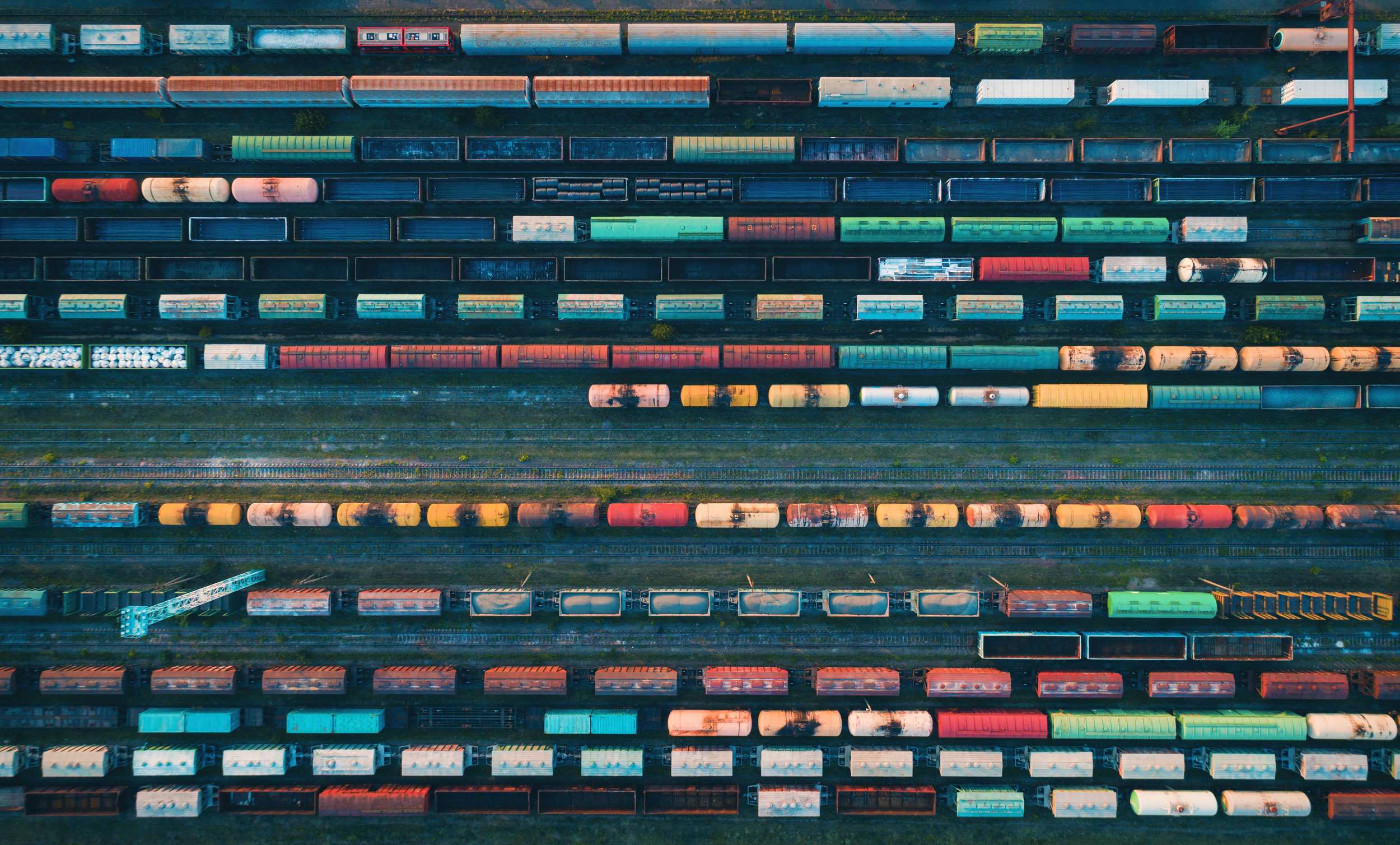 Aerial view of colorful freight trains on the rail