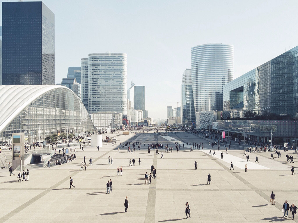 People_Walking_Between_Modern_Buildings