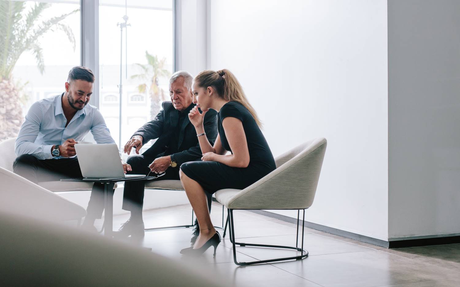 Mixed_Gender_Businesspeople_Meeting_in_Foyer