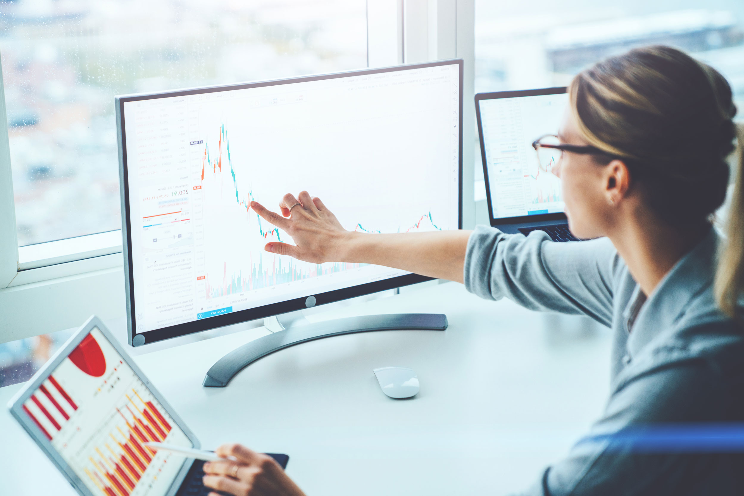 Woman_At Computer_With_Graphs_And_Statistics